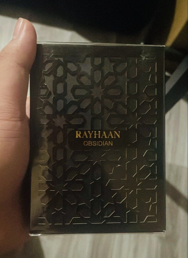 Rayhaan Obsidian Eau de Parfum for Men (Category: Fragrance & Deodorants) located in Quezon City. Submitted by brave_dowayne (Listing ID 1469128056, Image 2). Description: - Item: Rayhaan Obsidian Eau de Parfum for Men - Condition: Brand new in box, sealed with original plastic wrap (Never opened or sprayed) - Scent Profile: Rich oriental fragrance with dominant woody, iris, powdery, violet, leather, and earthy accords - Additional Notes: Subtle 