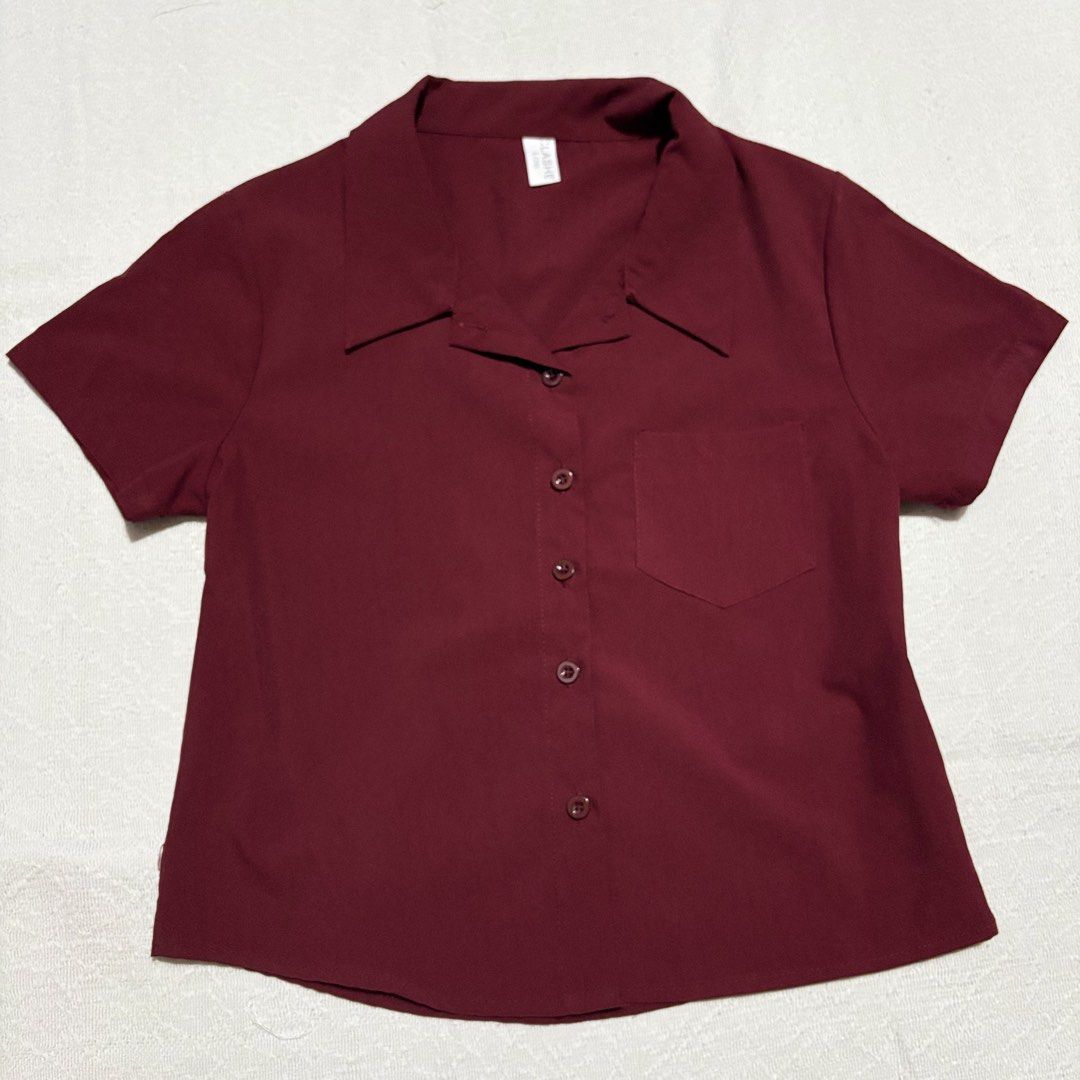 Red Blouse Polo (Category: Shirts) located in Bulacan. Submitted by luvjww (Listing ID 1469120843, Image 1). Description: - Color: Red Maroon - Size: L Shoulder: 39cm Bust: 92cm Sleeve Length: 16.5cm Length: 52cm - Details: Single chest pocket on the right side, smooth fabric, matching front buttons -Used.
