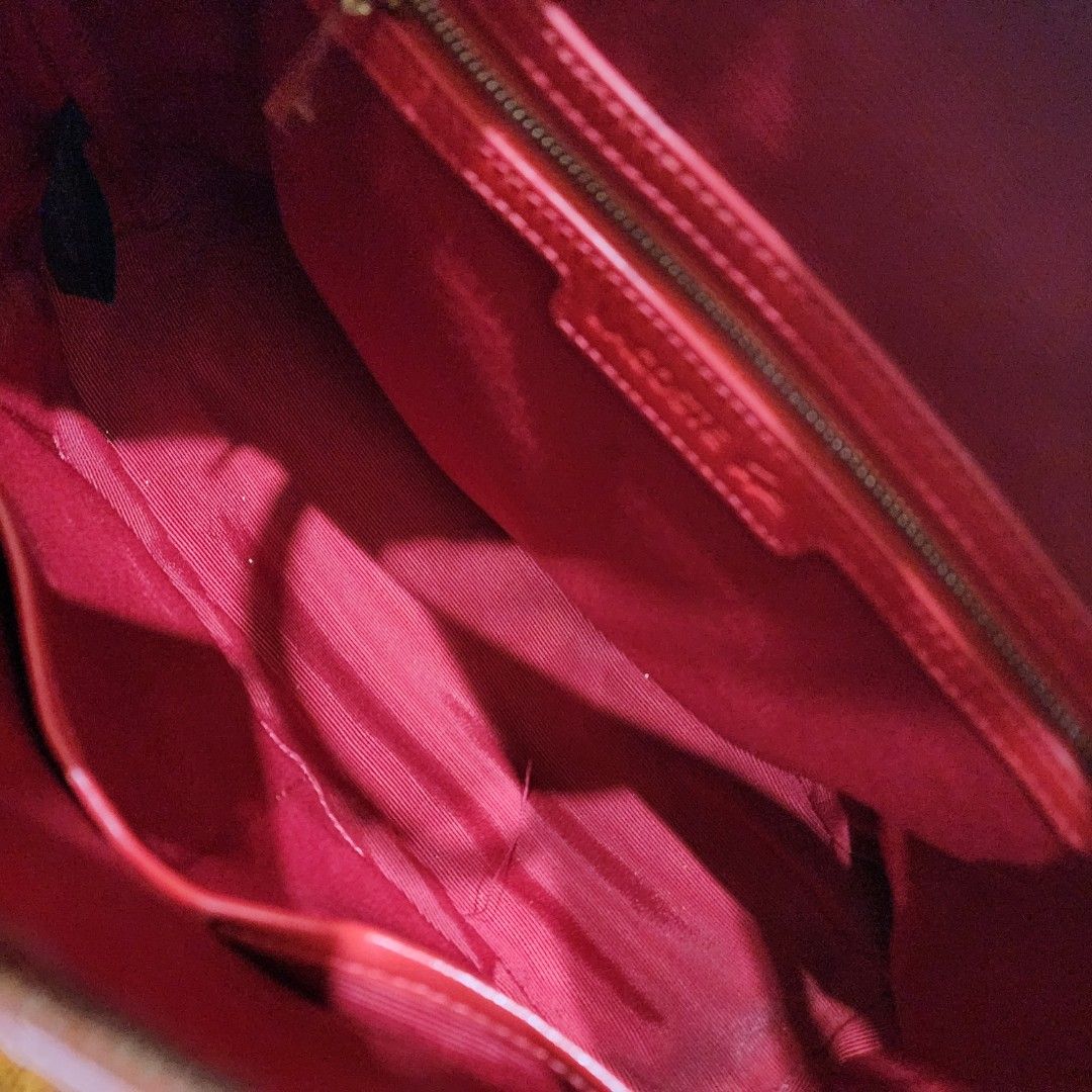 Red Lacoste Textured Handbag with Strap (Category: Tote Bags) located in Manila. Submitted by windelynon66264 (Listing ID 1469029655, Image 3). Description: - Brand: Lacoste - Color: Bright red with textured finish and gold logo hardware - Straps: Double top handles and a detachable long strap - Closure & Interior: Secure zip closure, lined interior with one zipper pocket and slip pockets - Condition: Pre-loved with minor wear visible on the hand