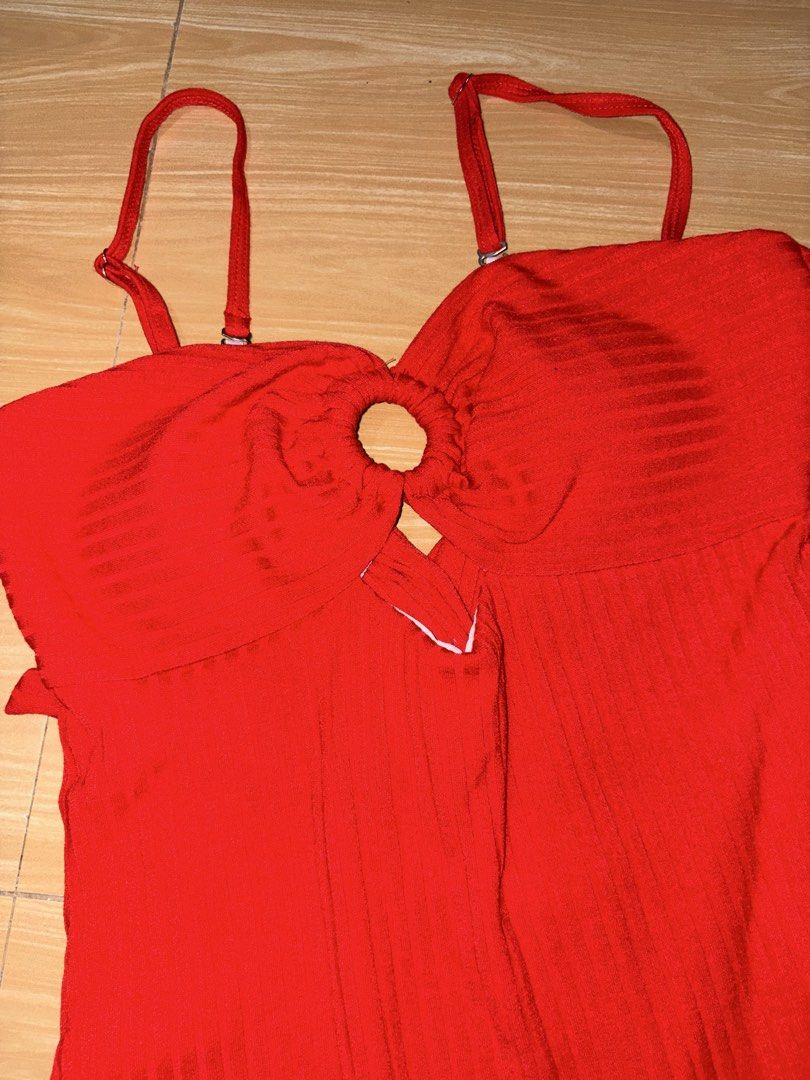 Red One-Piece Swimsuit with O-Ring Cutout (Category: Bikinis & Swimsuits) located in Caloocan City. Submitted by stella_mari27 (Listing ID 1469110136, Image 3). Description: - Color: Bright red - Material: Ribbed textured fabric (fully white lined) - Design: Center O-ring cutout front - Straps: Adjustable shoulders with criss-cross back - Fit: High-cut leg openings - Best for: Beach days and poolside chilling.