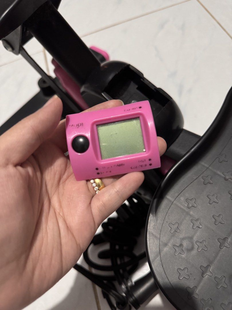 RIFOAMXN Mini Stepper Exercise Machine with Resistance Bands (Category: Cardio & Fitness Machines) located in Quezon City. Submitted by arianavelez (Listing ID 1468937643, Image 3). Description: - Brand: RIFOAMXN - Color: Black and pink - Includes resistance bands with handles for upper body workouts - Built-in digital monitor to track your progress (battery-operated) - Textured, non-slip foot pedals for safety and security - Compact and space-sa