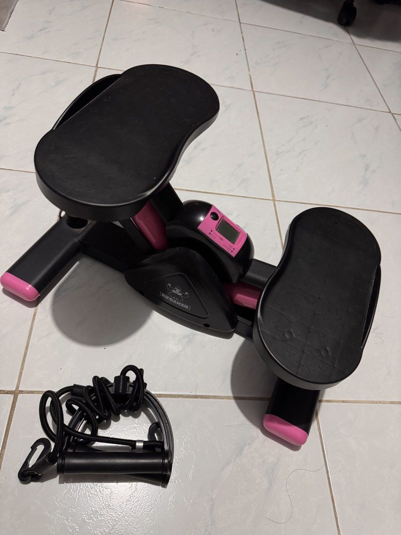 RIFOAMXN Mini Stepper Exercise Machine with Resistance Bands (Category: Cardio & Fitness Machines) located in Quezon City. Submitted by arianavelez (Listing ID 1468937643, Image 2). Description: - Brand: RIFOAMXN - Color: Black and pink - Includes resistance bands with handles for upper body workouts - Built-in digital monitor to track your progress (battery-operated) - Textured, non-slip foot pedals for safety and security - Compact and space-sa