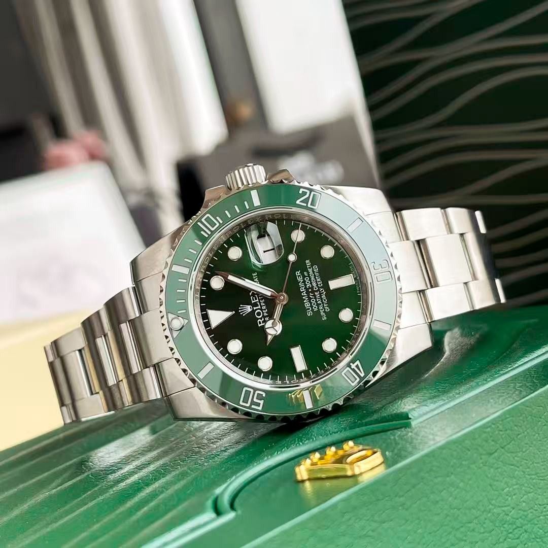 Rolex Submariner Green Dial Watch (Category: Luxury Watches) located in Bayang. Submitted by mysticbird77 (Listing ID 1469012514, Image 3). Description: - Model: Rolex Submariner (Hulk Colorway) - Dial: Striking green sunburst dial with date window and cyclops lens - Bezel: Matching green ceramic insert - Movement: Reliable automatic movement - Bracelet: Durable stainless steel Oyster bracelet - Inclusions: Original green presentation box - Condi
