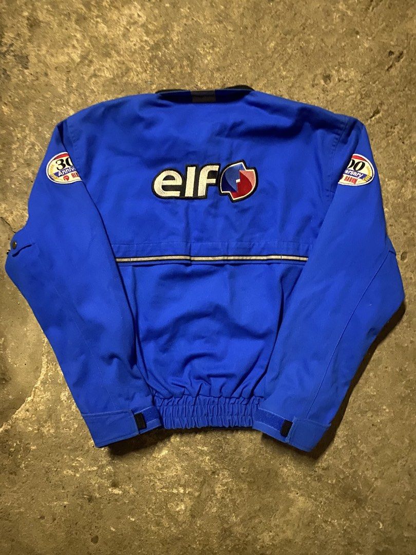 ROM Red Baron Elf Racing Jacket Blue Size M (Category: Coats, Jackets and Outerwear) located in Manila. Submitted by oddpenguin_cc96b9 (Listing ID 1469051618, Image 2). Description: - Brand: ROM Red Baron - Color: Bright blue - Size: Medium (M tag at collar) - Design: Large embroidered Elf logos on chest and back, with 30th Anniversary Red Baron patches on both sleeves - Features: High collar with snap strap, full zip front, and reflective piping