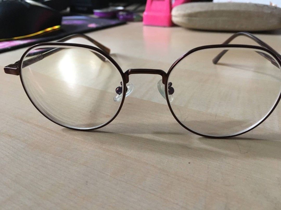 Round Glasses with cases (Category: Sunglasses & Eyewear) located in Manila. Submitted by miax_1222 (Listing ID 1468986695, Image 3). Description: - Two trendy round metal frame glasses - Pair 1: Clear frame with sleek silver arms (Unknown brand) - PHP 300 - Pair 2: Classic brown metal frame (From EO) - PHP 450 - Lightweight and comfortable for all-day wear, perfect for daily wear - interested buyers must shoulder both lalamove booking and sf - I