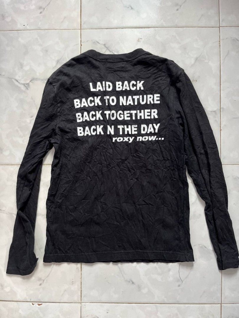ROXY Black Long Sleeve Tee Size L (Category: Longsleeves) located in Caloocan City. Submitted by kimronnel (Listing ID 1468953476, Image 2). Description: - Brand: Roxy - Item: Black long sleeve t-shirt - Size: Large - Details: Small red chest logo patch, classic crew neckline, regular fit - Condition: Good, shows natural wrinkling from storage - Style: Solid black, easy to match with casual everyday outfits.