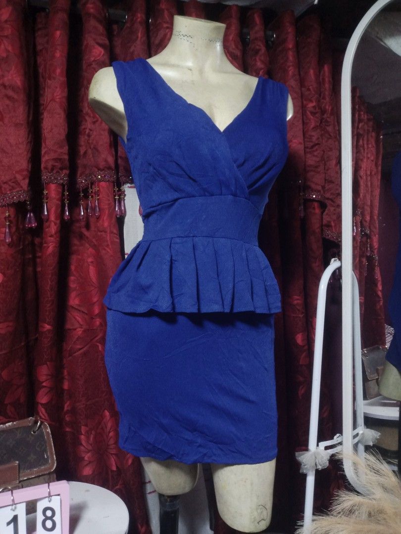 Royal blue mini dress (Category: Dresses) located in Manila. Submitted by wheneity67thifted (Listing ID 1469158458, Image 2). Description: Style Details Color: Royal blue / cobalt blue Neckline: V-neck with a wrap or pleated bodice detail Silhouette: Fitted pencil/sheath skirt with a defined waist and pleated peplum ruffle overlay Sleeves: Sleeveless / wide straps.