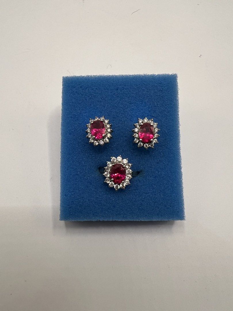 Ruby Red Oval Stone Ring and Earrings Set (Category: Earrings) located in Meycauayan. Submitted by maricarfvelasco26 (Listing ID 1469078319, Image 1). Description: - Stunning matching set: 1 ring and 2 earrings - Vibrant red oval center stones with clear pave crystals - Elegant silver-tone metal finish - Classic floral cluster design - Perfect for formal events or dressing up casual looks - Item is being sold for a friend.