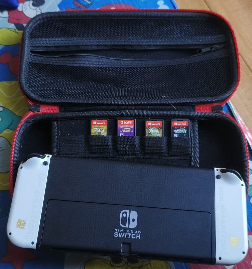 Rush BUNDLE with gamecarts Nintendo Switch Oled (Category: Nintendo) located in Manila. Submitted by leahcim02 (Listing ID 1469011167, Image 2). Description: Sale or swap sa cp pass sa barat pwede oled lang or games lang 1700 each 99%smooth guaranteed no issue all working package: unit orig charger orig dock case and 4pcs gamecarts Zelda BOTW, Zelda TOTK, Pokemon ZA, Pokemon Violet Meet up: Any Malls in NCR/Antipolo.