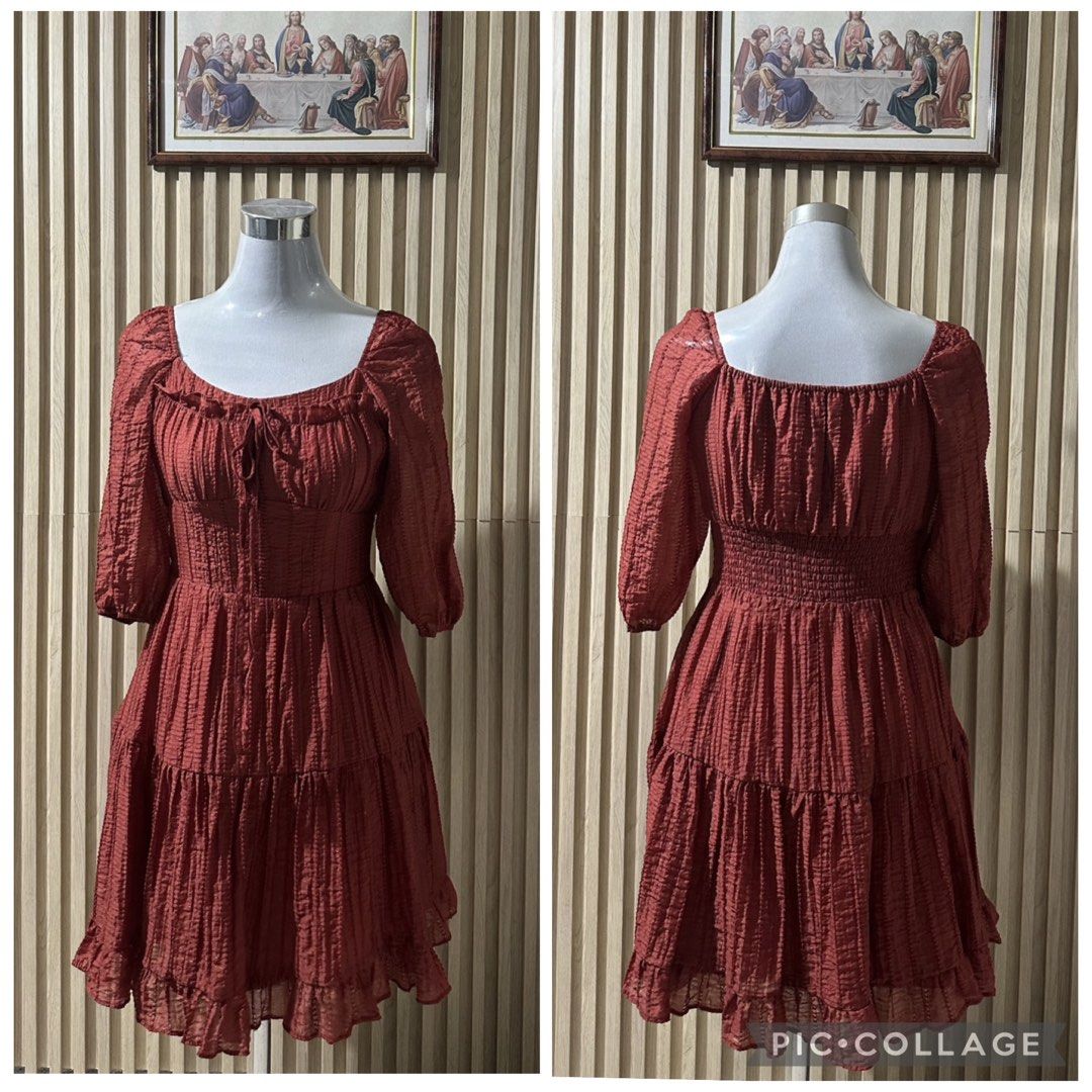 Cute Rust Dress with Tie Ribbon (Category: Dresses) located in Quezon City. Submitted by yourchingu16 (Listing ID 1469142024, Image 1). Description: - Price: 375 if with other items - Autumn Color - Design: Square neckline with front tie ribbon, smocked back for a great fit, midi-length sleeves, and a tiered ruffled skirt - Closure: Convenient side zipper MANNEQUIN Body Frame/Measurement Shoulder - 16” Bustline - 34” Waistline - 27” Hip - 36” .