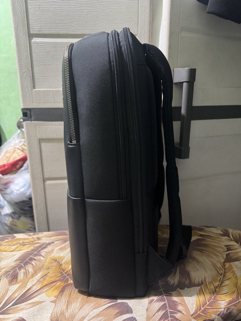 Samsonite Red Neumont 4 Backpack (Category: Backpacks) located in San Juan City. Submitted by poldzhon (Listing ID 1469097646, Image 2). Description: - Brand: Samsonite - Color: Classic Black with stylish leather accents - Material: Durable fabric construction - Storage: Multiple zippered compartments for easy organization - Comfort: Padded mesh shoulder straps and back panel - Features: Sturdy top grab handle and heavy-duty zippers - Condition: 