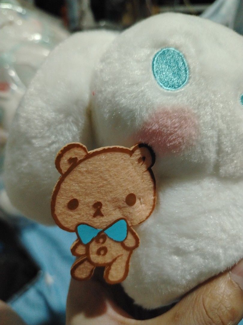 Sanrio Cinnamoroll Plush Toy with Bear Accessory (Category: Plushies & Soft Toys) located in Manila. Submitted by joycechua439850 (Listing ID 1468995457, Image 2). Description: - 100% Official Sanrio Cinnamoroll plush toy - Super soft all-over white fur with cute blue embroidered eyes and pink cheeks - Holding an adorable small felt bear with a blue bowtie - Includes original hang tags (blue and white checkered pattern with Cinnamoroll graphics) 
