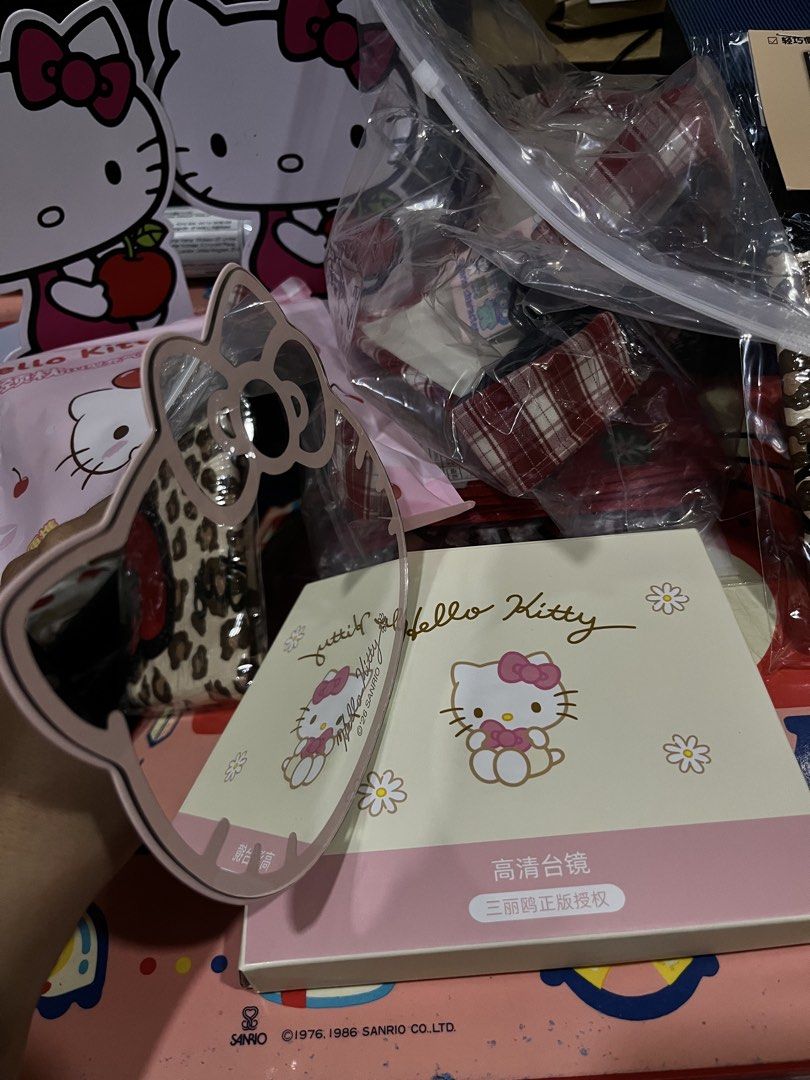 Sanrio Hello Kitty Pink Desktop Mirror with Stand (Category: Mirrors) located in Manila. Submitted by janetecson05 (Listing ID 1468977466, Image 3). Description: - Authentic Sanrio Kitty shaped desktop mirror - Features a sturdy white foldable stand for easy tabletop setup - Comes with the original floral graphics box - Official Sanrio licensed merchandise - Perfect vanity accessory and gift for Kitty fans.
