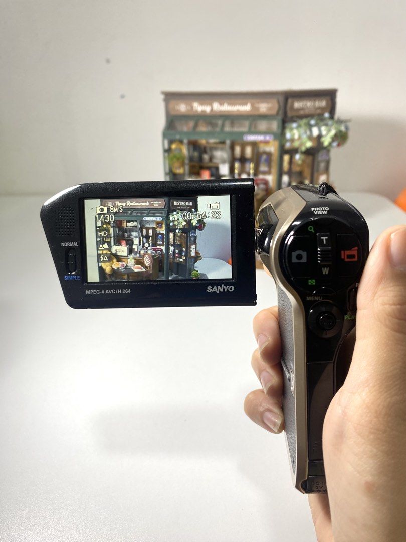 Sanyo Xacti DMX-HD800 (Category: Cameras) located in Quezon City. Submitted by helloclassiques (Listing ID 1469023261, Image 3). Description: ִֶָ𓂃 ࣪˖ ִֶָ🐇་༘࿐ Sanyo Xacti HD800 All buttons working. With built-in flash best for taking photos and low-light shooting. 🔆🎥📸 Clean lens and LCD— no dead pixel. Monitor rotates up to 270 degrees, perfect for self-recording. ✨ Specs: 8 MP 720p HD 2.7” LCD 5x optical zoom CMOS sensor SD Memory Card Type 