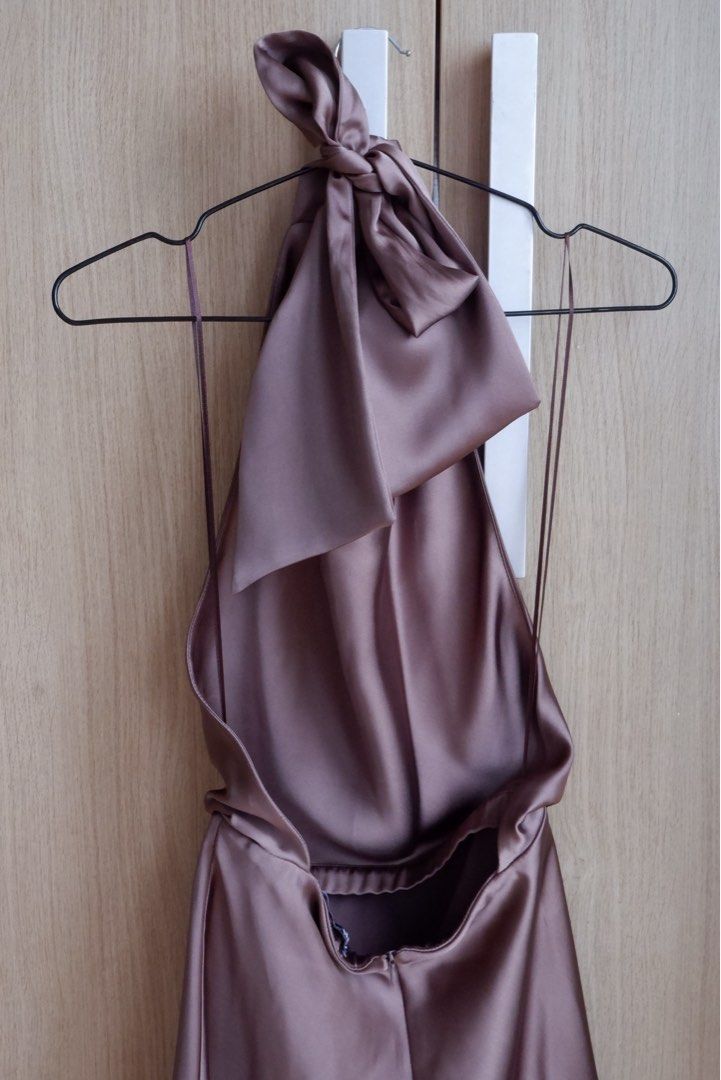 Satin Cowl Neck Mini Dress (Category: Dresses) located in Makati City. Submitted by kimberlyjohn (Listing ID 1468995277, Image 3). Description: - Style: Satin mini dress with cowl neck and open back - Feature: Cute bow detail at the back - Material: Smooth fabric with a slight sheen - Condition: Worn once.