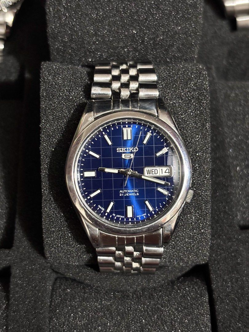 Seiko 5 Blue Grid Dial Automatic (Category: Men's Watches) located in Manila. Submitted by jey09 (Listing ID 1469099395, Image 1). Description: Seiko 5 Blue Grid Dial Automatic •37mm •Newly serviced and polished •With replacement box and paper bag •Open back case ₱3500.
