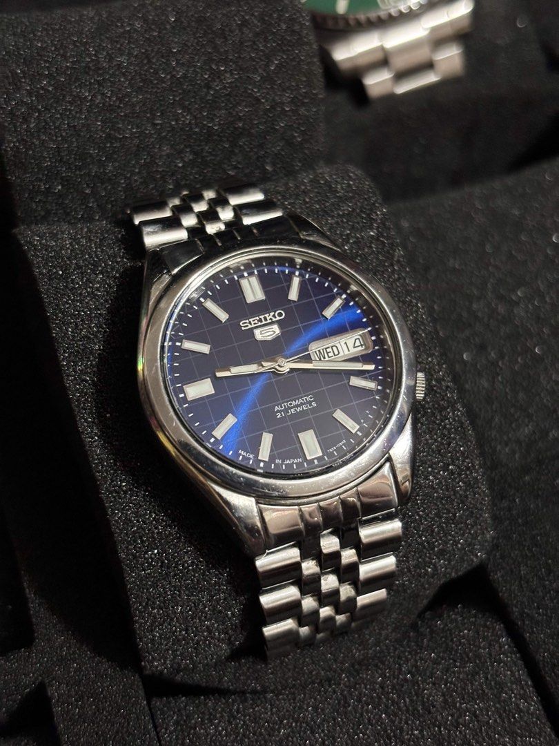 Seiko 5 Blue Grid Dial Automatic (Category: Men's Watches) located in Manila. Submitted by jey09 (Listing ID 1469099395, Image 2). Description: Seiko 5 Blue Grid Dial Automatic •37mm •Newly serviced and polished •With replacement box and paper bag •Open back case ₱3500.