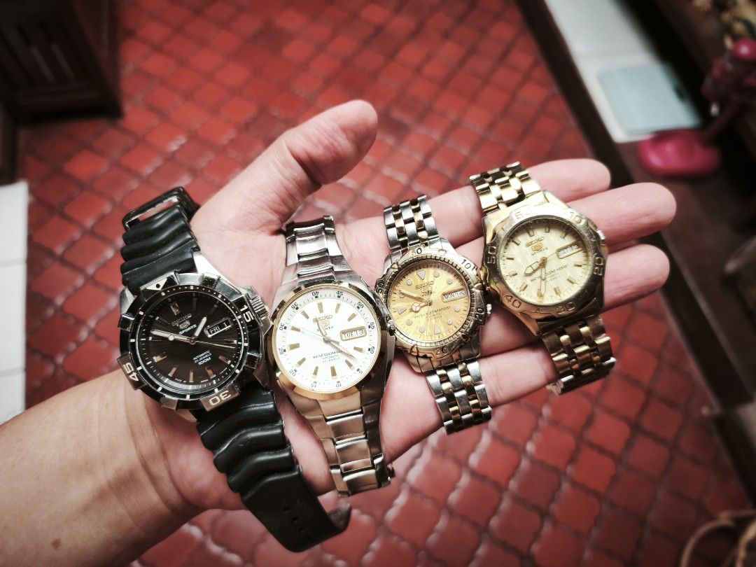 Seiko 5 Sports Automatic (4 pcs) (Category: Men's Watches) located in Manila. Submitted by raffy.dlc (Listing ID 1468965079, Image 1). Description: Seiko 5 Sports (4pcs) 7S36 automatic movement Made in Japan, 23 Jewels 100 Meters water resistant All original Head and Bracelet Gold wave Dial, two tone silver and gold, 40mm PHP 3,200 Yellow Gold wave Dial, gold bracelet, 40mm PHP 2,200 Textured Black dial, "Mini Stargate" With AM rubber strap, rota