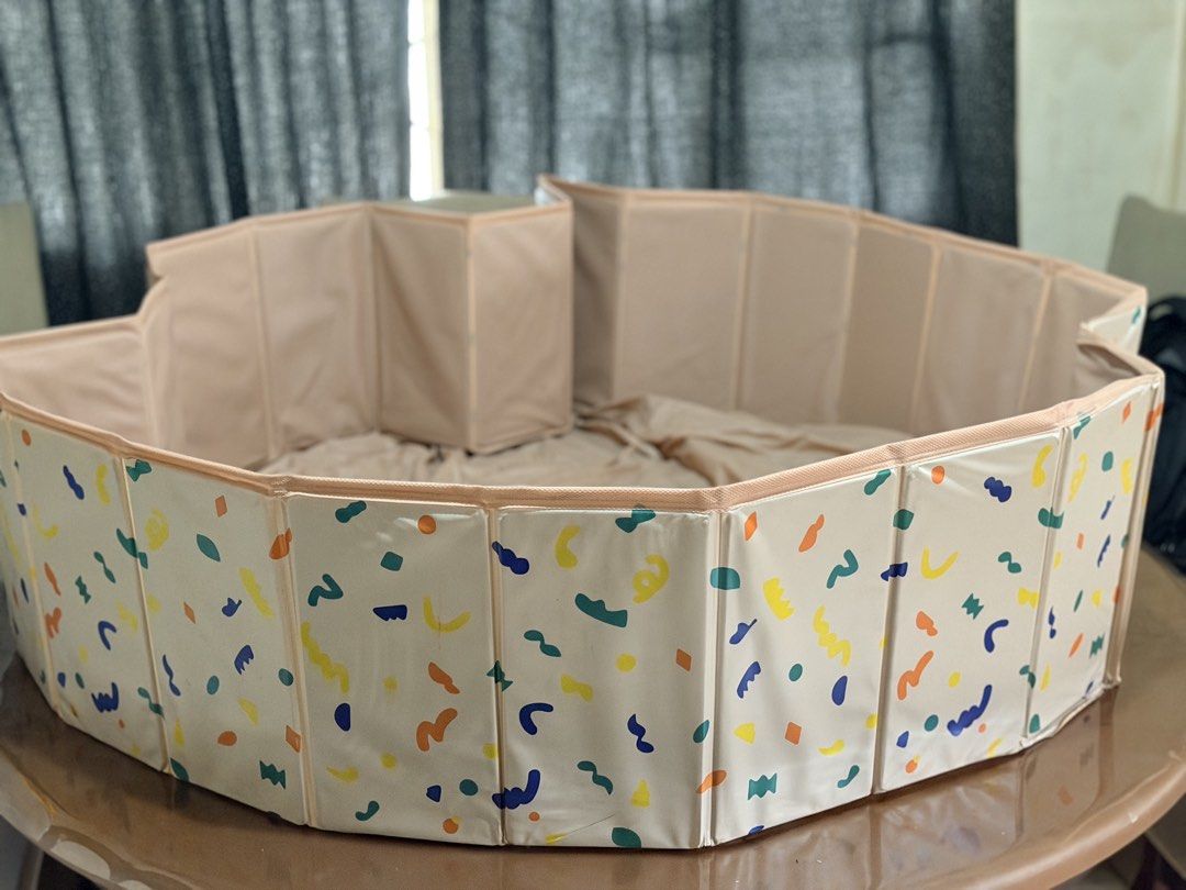 Sensory Pit /Ball pit (Category: Infant Playtime) located in Paranaque City. Submitted by sweetiesarah01 (Listing ID 1469057461, Image 1). Description: - Adorable cream round ball pit with colourful abstract outer prints - Sturdy folding walls maintain their shape during play - Soft fabric bottom for comfortable toddler seating - Convenient drainage hole with black cap on the side - Folds flat easily for quick storage and packing away - Great sol