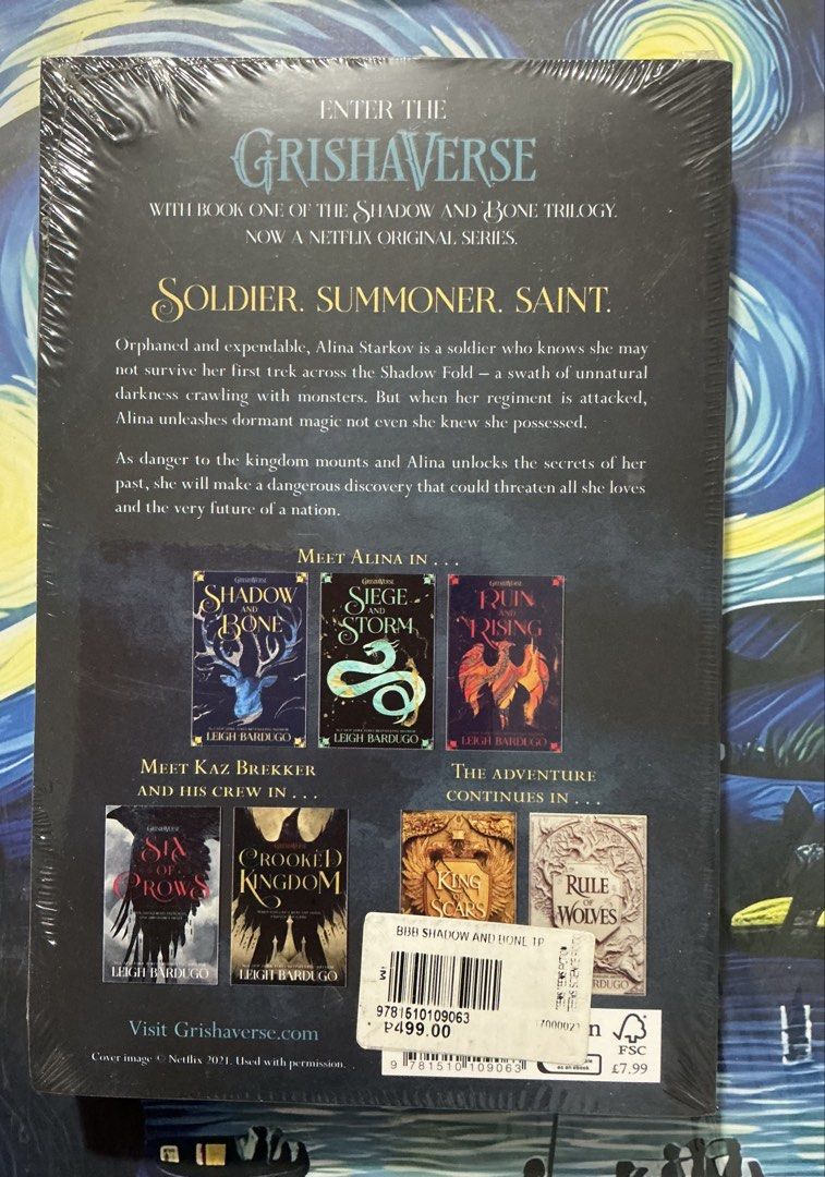 Shadow and Bone by Leigh Bardugo paperback novel (Category: Storybooks) located in Manila. Submitted by mightydragon_9e8da9 (Listing ID 1468997552, Image 2). Description: - Title: Shadow and Bone by Leigh Bardugo - Condition: Brand new, still in original plastic shrink wrap - Edition: Grishaverse Trilogy Book 1 (Netflix tie-in cover) - Details: Store price sticker attached on the back - Perfect for: Fantasy book fans and collectors.