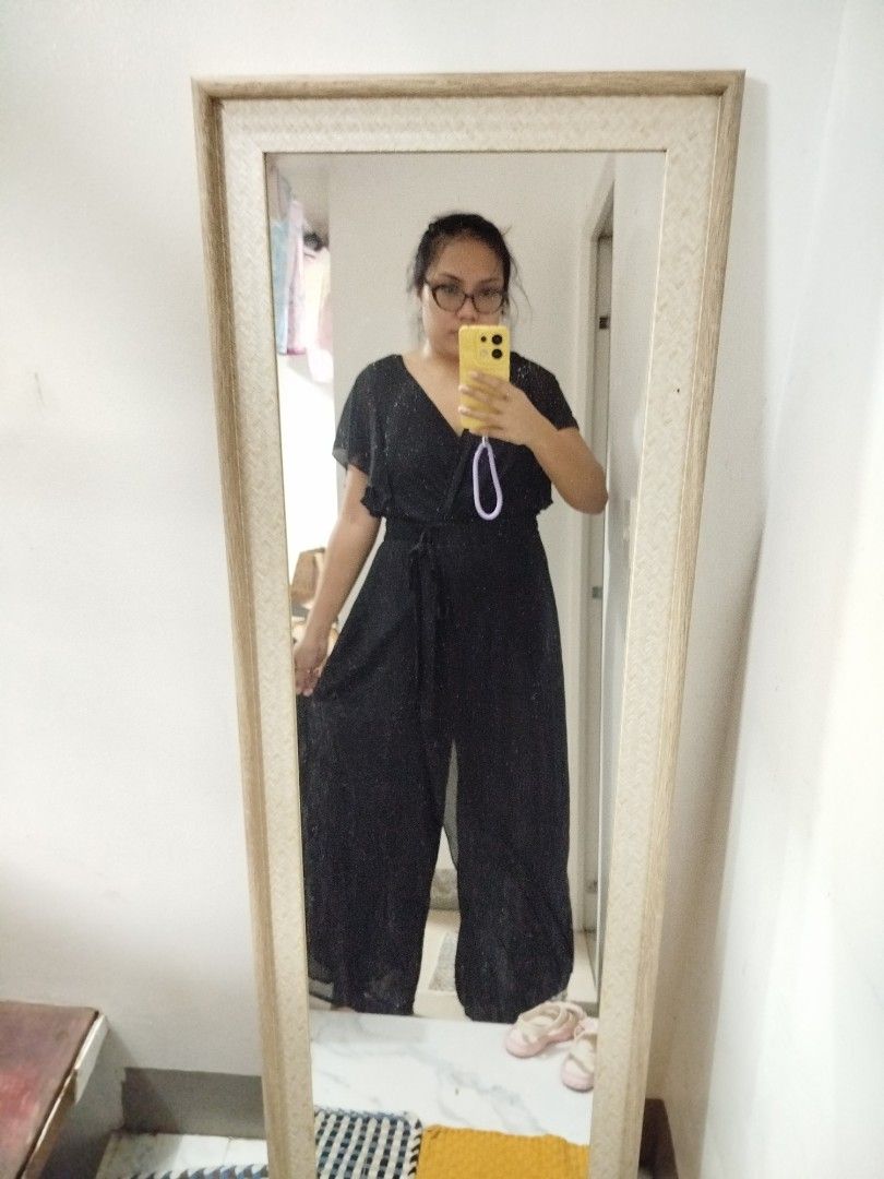 Shein Black Jumpsuit Size XL (Category: Jumpsuits) located in Taguig. Submitted by dreazac (Listing ID 1469082334, Image 3). Description: - Brand: Shein - Color: Classic Black - Size: Fits up to XL - Measurements: Bust 40" | Waist 37" | Length 59" - Features: V-neck, flutter sleeves, wide-leg cut, and includes a waist tie belt - Perfect for: Office wear, formal events, or smart-casual outings - Mode of Payment: GCash, BPI, or Bank Transfer - Ship