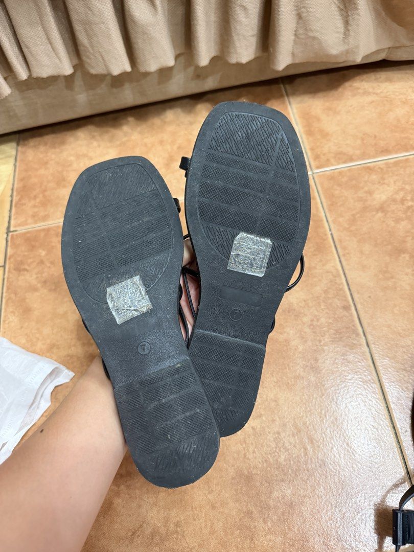 Shein Black Strappy Flat Sandals US 7 (Category: Flats & Sandals) located in Carmona. Submitted by beaburrito (Listing ID 1468953077, Image 2). Description: - Brand: Shein - Style: Black strappy flat sandals with gold-tone toe ring and square open toe - Size: US 7 (stamped on footbed and outsole) Slightly worn, with original adhesive stickers still on soles .