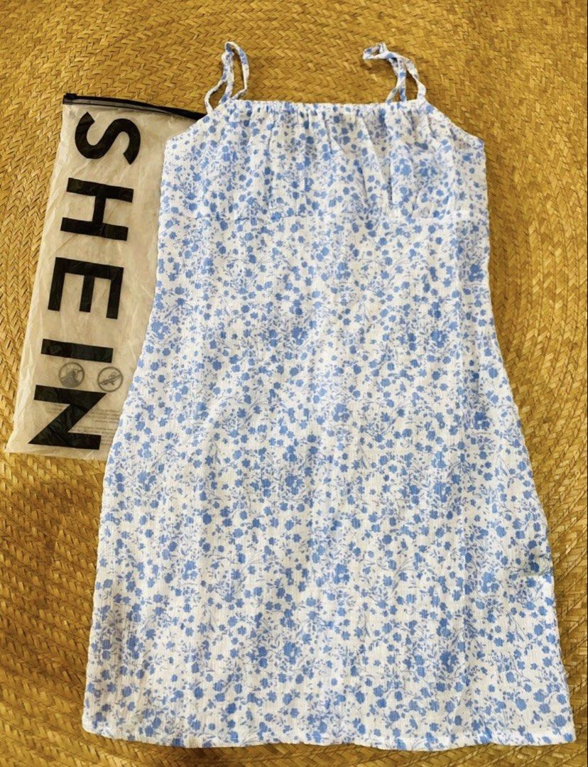 SHEIN Blue Floral Spaghetti Strap Mini Dress Size M (Category: Dresses) located in Marikina City. Submitted by jessylady10 (Listing ID 1468980310, Image 1). Description: - Brand: SHEIN - Style: Blue and white floral mini dress with spaghetti straps and square neckline - Size: Medium (EU 38 / US 6) - Condition: Brand new with tags attached, in original packaging - Material: Lightweight textured fabric - Perfect for: Warm weather, casual outings, a
