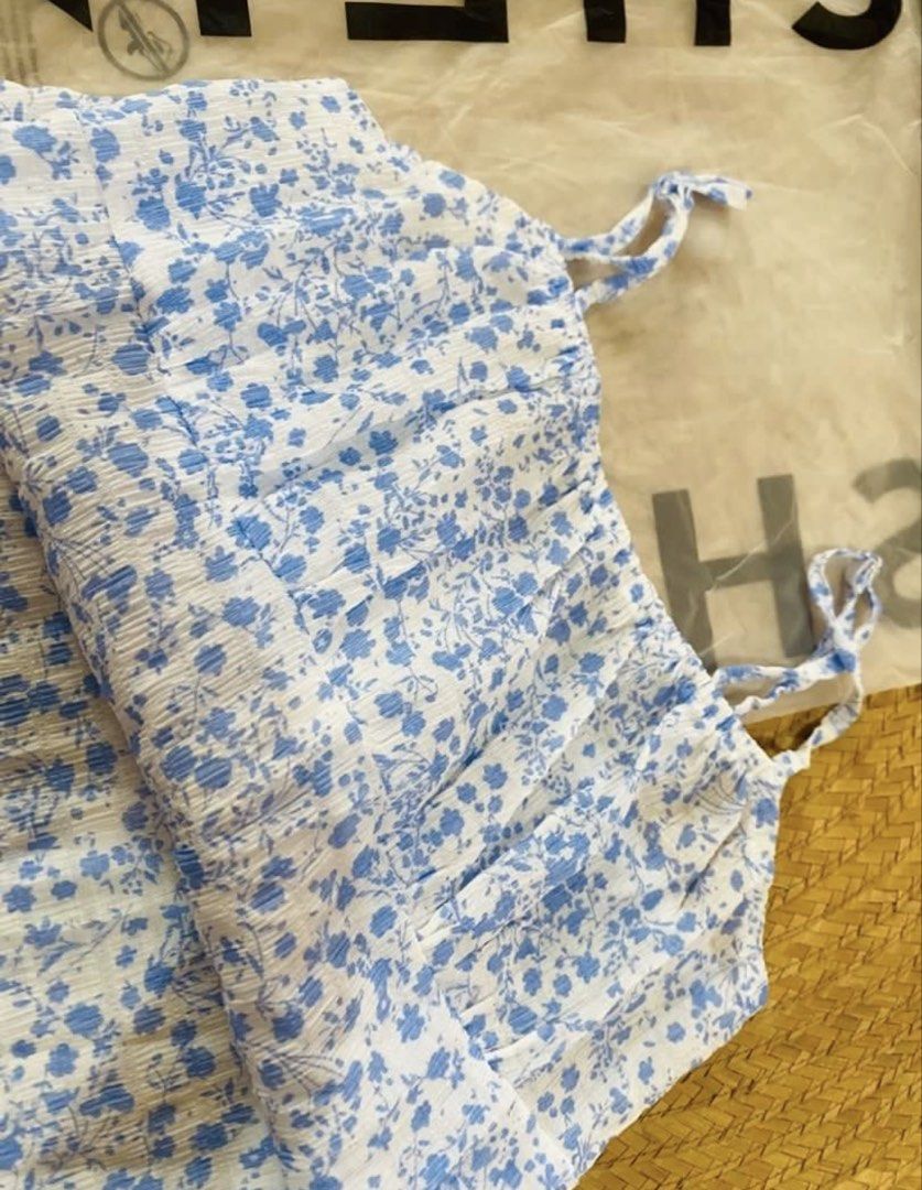 SHEIN Blue Floral Spaghetti Strap Mini Dress Size M (Category: Dresses) located in Marikina City. Submitted by jessylady10 (Listing ID 1468980310, Image 2). Description: - Brand: SHEIN - Style: Blue and white floral mini dress with spaghetti straps and square neckline - Size: Medium (EU 38 / US 6) - Condition: Brand new with tags attached, in original packaging - Material: Lightweight textured fabric - Perfect for: Warm weather, casual outings, a