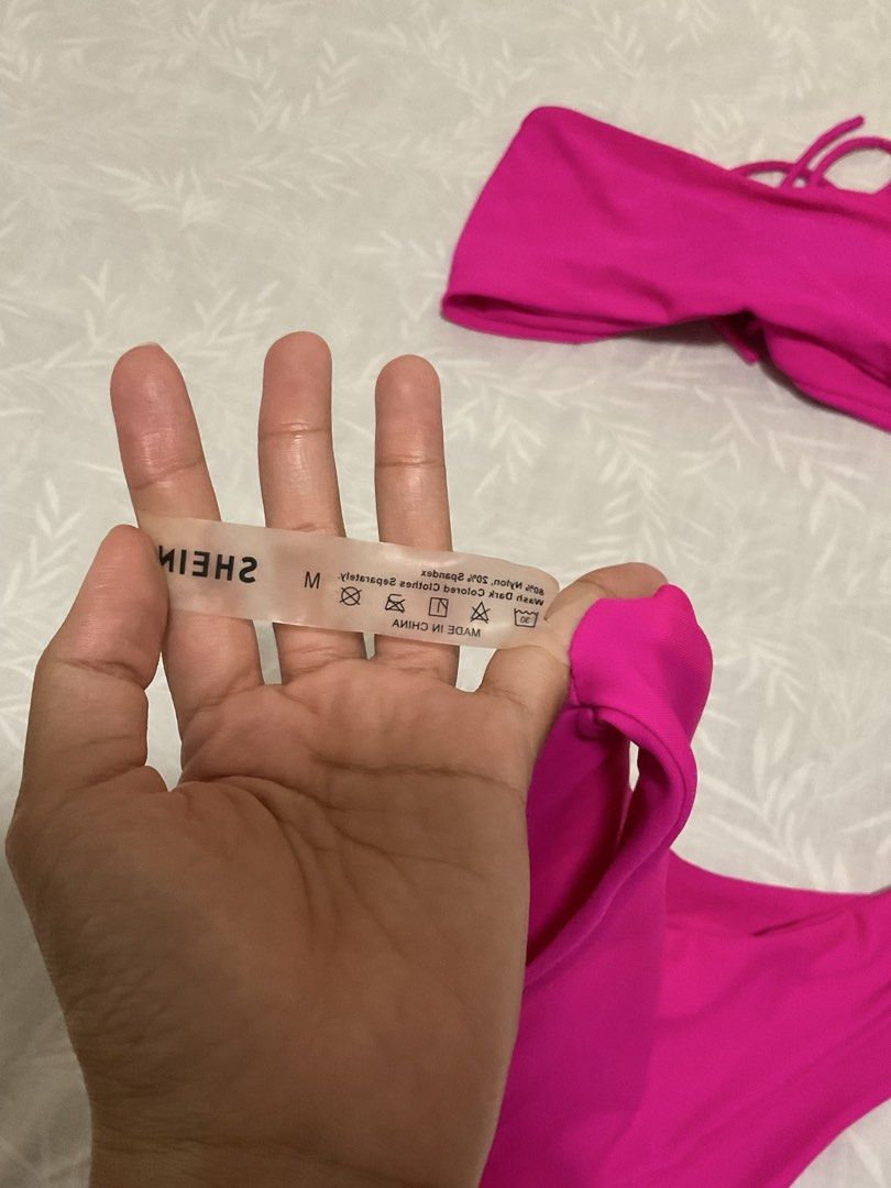 SHEIN Hot Pink Two-Piece Bikini Set (Category: Bikinis & Swimsuits) located in Taytay. Submitted by prelovedbyblaire (Listing ID 1469102991, Image 2). Description: - Brand: SHEIN - Item: Bright hot pink bikini set - Size: Medium (tags attached) - Condition: Brand new, unworn - Design: Bandeau top with strap details and matching bottoms - Perfect for: Beach trips and pool days.
