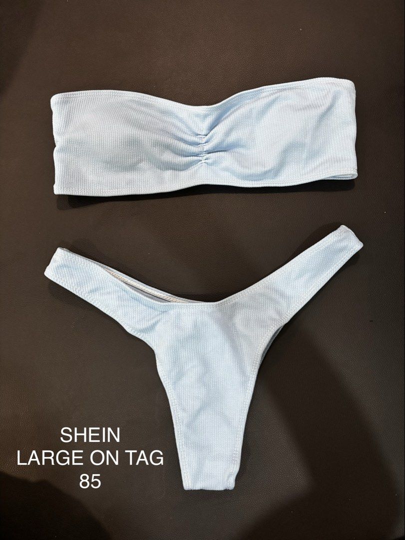 SHEIN Light Blue Ribbed Bikini Set Large (Category: Bikinis & Swimsuits) located in Valenzuela. Submitted by cleighr (Listing ID 1469100434, Image 1). Description: - Brand: SHEIN - Style: Light blue ribbed two-piece bikini - Top: Bandeau style with trendy center ruching detail - Bottoms: High-cut, cheeky fit - Size: Large - Material: Stretchy, comfortable textured fabric.