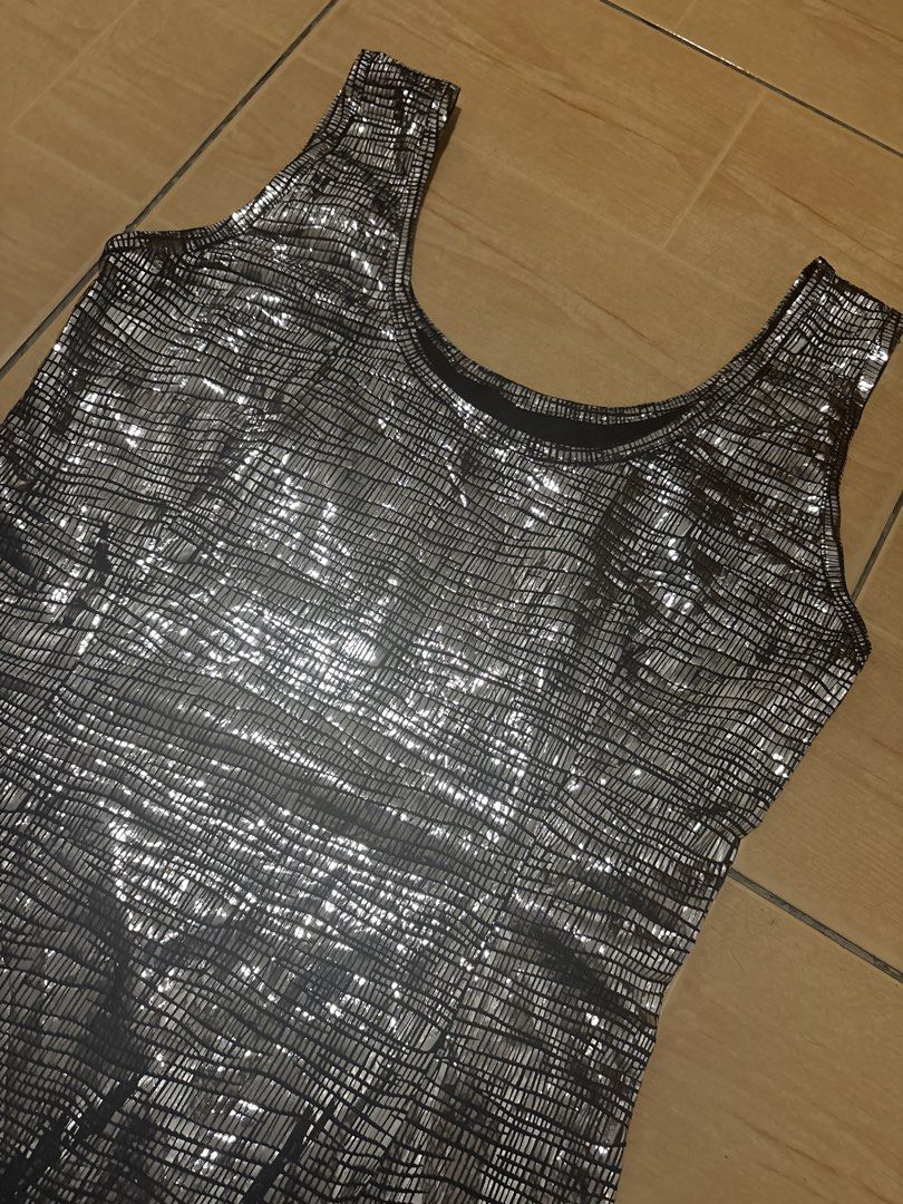 Silver Metallic Grid Pattern Tank Dress Party Midi (Category: Dresses) located in Cabuyao City. Submitted by airpz (Listing ID 1469069939, Image 2). Description: - Style: Silver metallic midi dress with a chic grid pattern - Fit: Fitted silhouette, knee-length, and stretchy textured fabric for comfort - Design: Scoop neckline with a sleeveless tank style - Occasion: Ideal for parties, nights out, and special events Waist 28-30.
