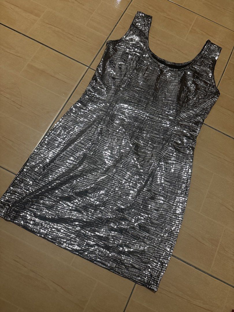 Silver Metallic Grid Pattern Tank Dress Party Midi (Category: Dresses) located in Cabuyao City. Submitted by airpz (Listing ID 1469069939, Image 3). Description: - Style: Silver metallic midi dress with a chic grid pattern - Fit: Fitted silhouette, knee-length, and stretchy textured fabric for comfort - Design: Scoop neckline with a sleeveless tank style - Occasion: Ideal for parties, nights out, and special events Waist 28-30.
