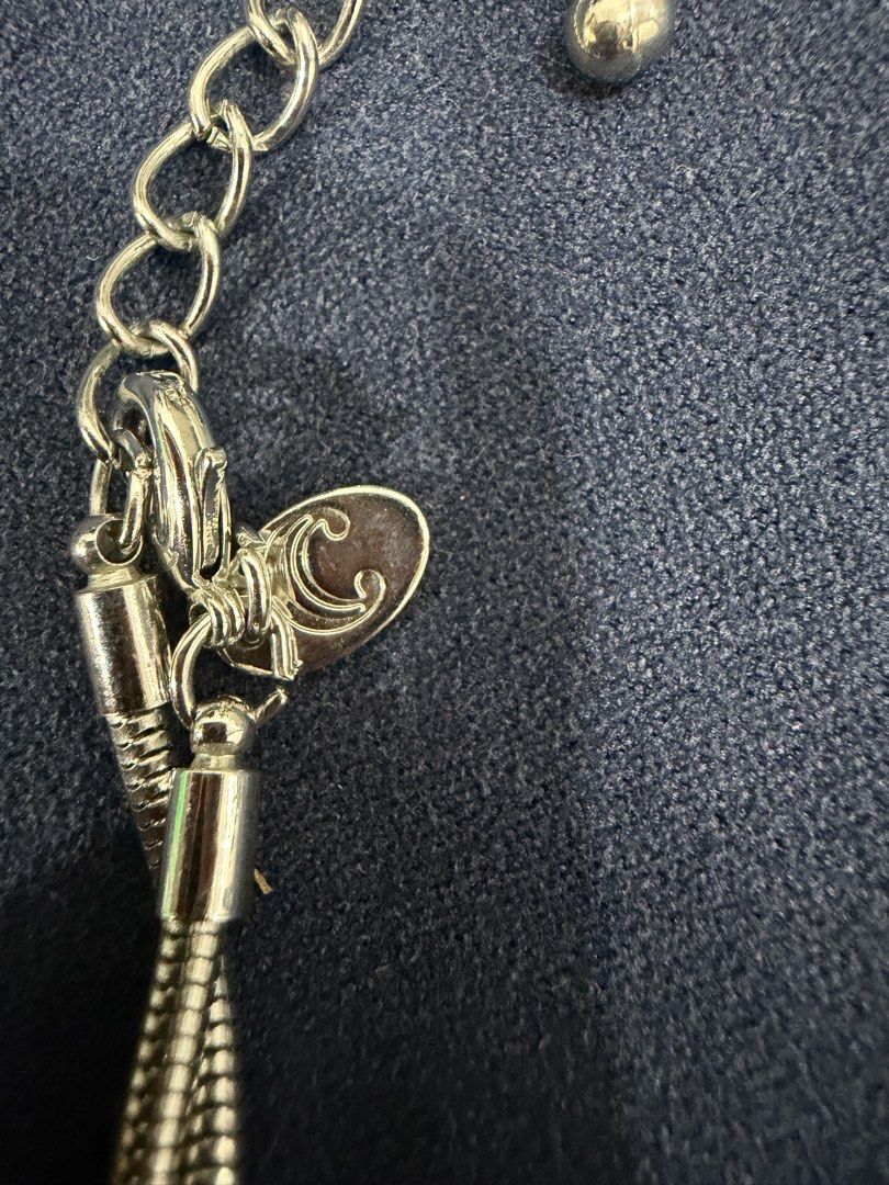 Silver Tone Long Chain Necklace with Tassels (Category: Necklaces) located in Makati City. Submitted by petite_preloved2 (Listing ID 1469063477, Image 2). Description: - Brand- Charming Charlie - Style: Silver-tone long necklace with snake chains - Feature: Double tassel drops with stylish cone caps - Fit: Adjustable chain closure for a customized length - Detail: Includes a cute small logo charm near the clasp - Condition: Clean metal finish thr