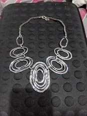Silver/Gold Metallic Toned necklaces (Category: Necklaces) located in Caloocan City. Submitted by mma_222 (Listing ID 1468976684, Image 2). Description: - Gold/silver-toned statement necklaces with a brushed metallic finish - Textured pieces in a cascading design - Double chain link connects the centerpiece to a secure clasp closure - Bold accessory ideal for dressing up plain tops and dresses.