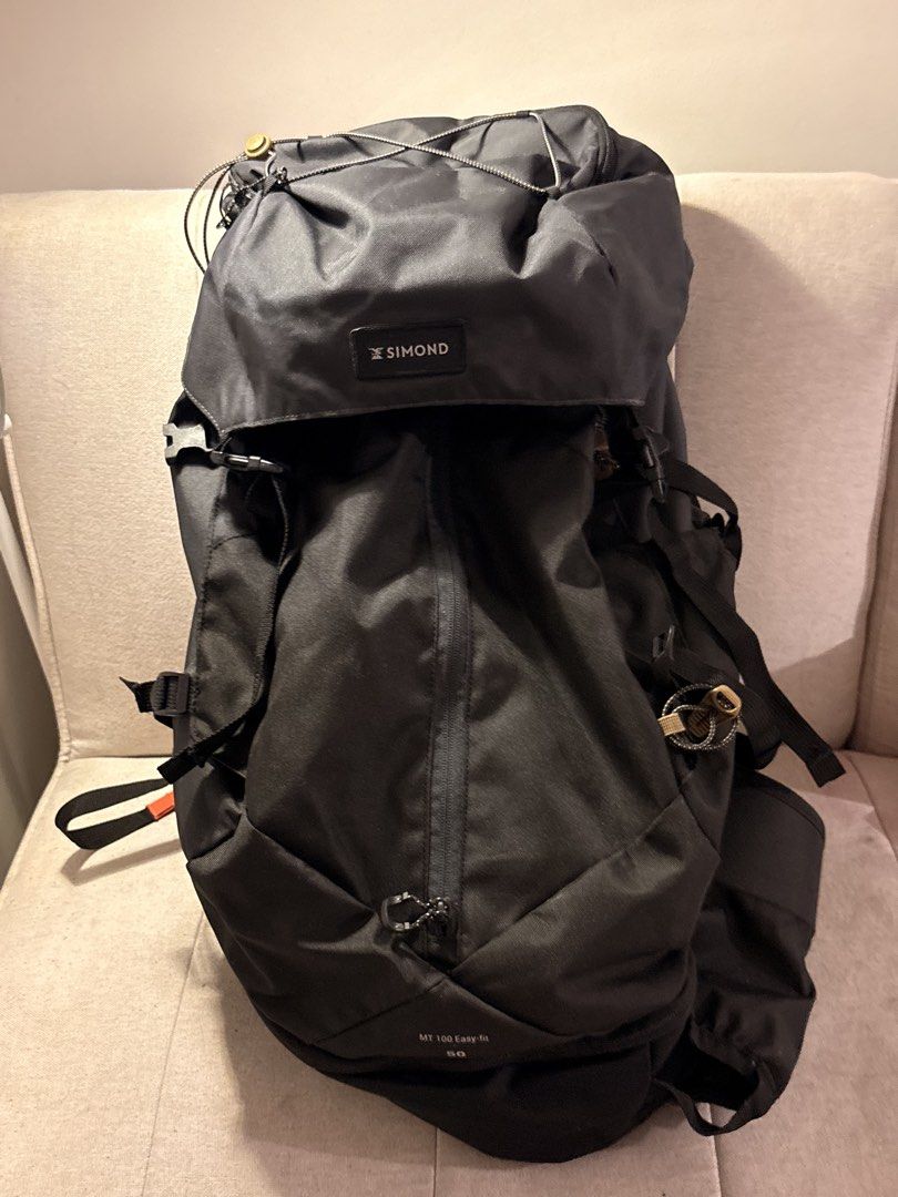 Simond MT 100 Easy-fit 50L Hiking Backpack (Category: Backpacks) located in Pasig City. Submitted by shitaku.ph (Listing ID 1469111269, Image 2). Description: - Brand/Model: Simond MT 100 Easy-fit Hiking Backpack - Color: Dark Grey - Capacity: 50 Litres (ideal for multi-day treks) - Comfort: Adjustable shoulder straps and supportive hip belt with a zipped pocket - Accessibility: Front vertical zip for easy main compartment access - Storage: Top l