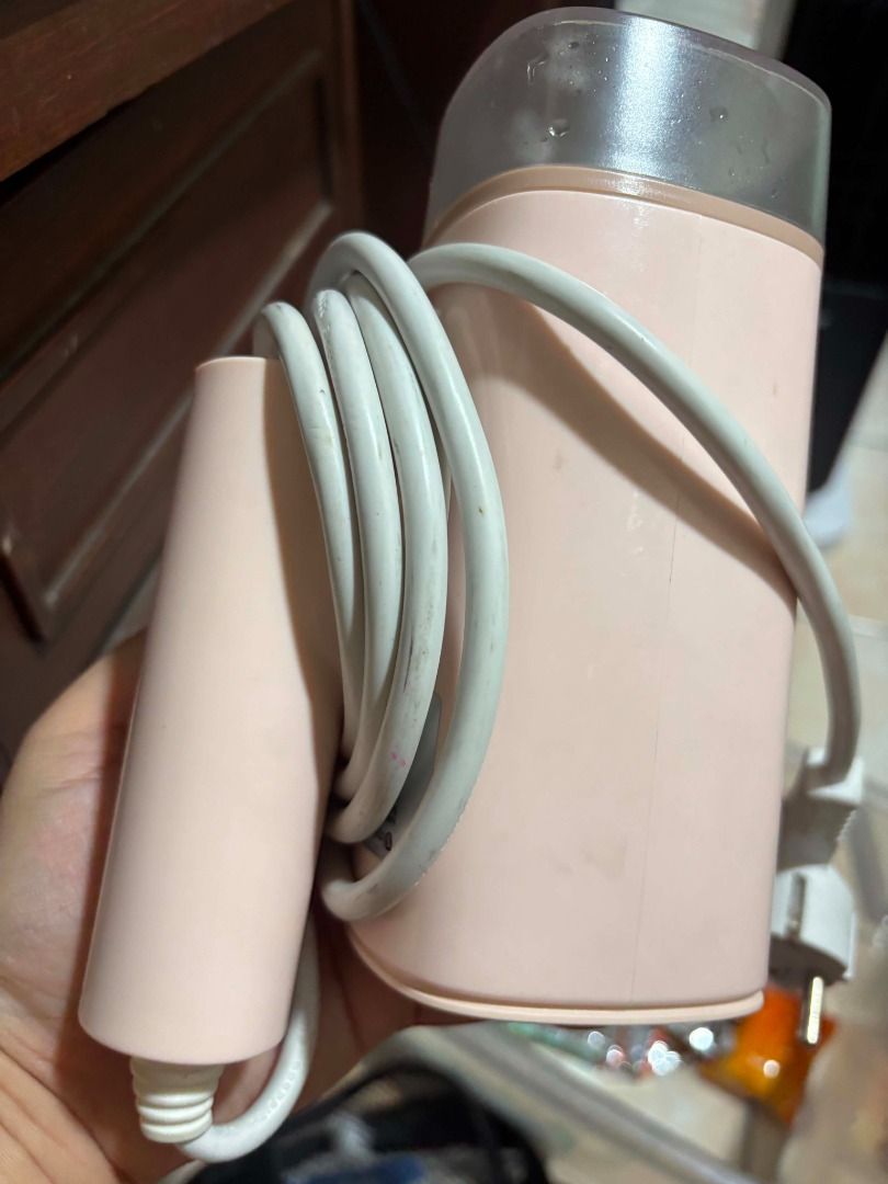 Simplus Portable Garment Steamer Pink (Category: Irons & Steamers) located in Manila. Submitted by cyrineravina (Listing ID 1468977561, Image 3). Description: - Brand: Simplus mini garment steamer - Color: Pastel pink - Condition: Fully functional - Features: Compact size with clear water tank, great for travel and quick touch-ups.