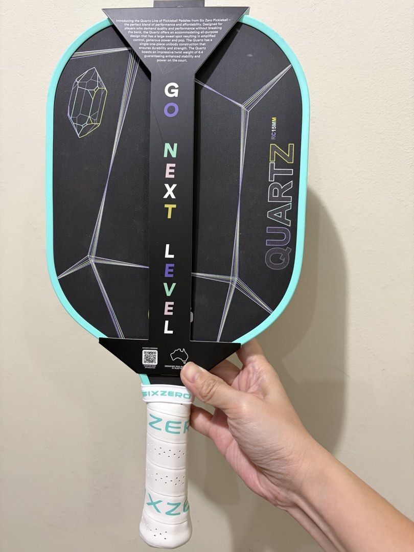 Six Zero Quartz Control Pickleball Paddle 15mm (Category: Racket and Ball Sports) located in Las Pinas. Submitted by bellagirl28 (Listing ID 1468993873, Image 2). Description: - Model: Six Zero Quartz Pickleball Paddle - Condition: Mint, includes original box and packaging - Specs: 15mm thickness, standard shape, control-focused model - Material: Raw carbon fiber face - Design: Black face with crystal geometric graphic and mint green edge guard -