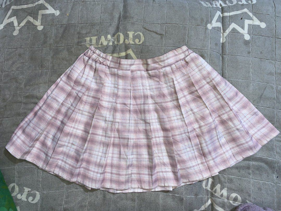 Skirt Color Pink (Category: Skirts) located in Manila. Submitted by dnlprtll (Listing ID 1469097296, Image 1). Description: > Pink Plaid Pleated Tennis Mini Skirt - Y2K / Kawaii > > - No brand / Generic (China) > - Color: Pastel pink, white plaid > - Material: 100% Polyester - lightweight, breathable, holds pleats well > - Size on tag: 140/60 - fits XS to Small, high-waisted > - Style: A-line pleated, mini length, elastic garter at back for stret