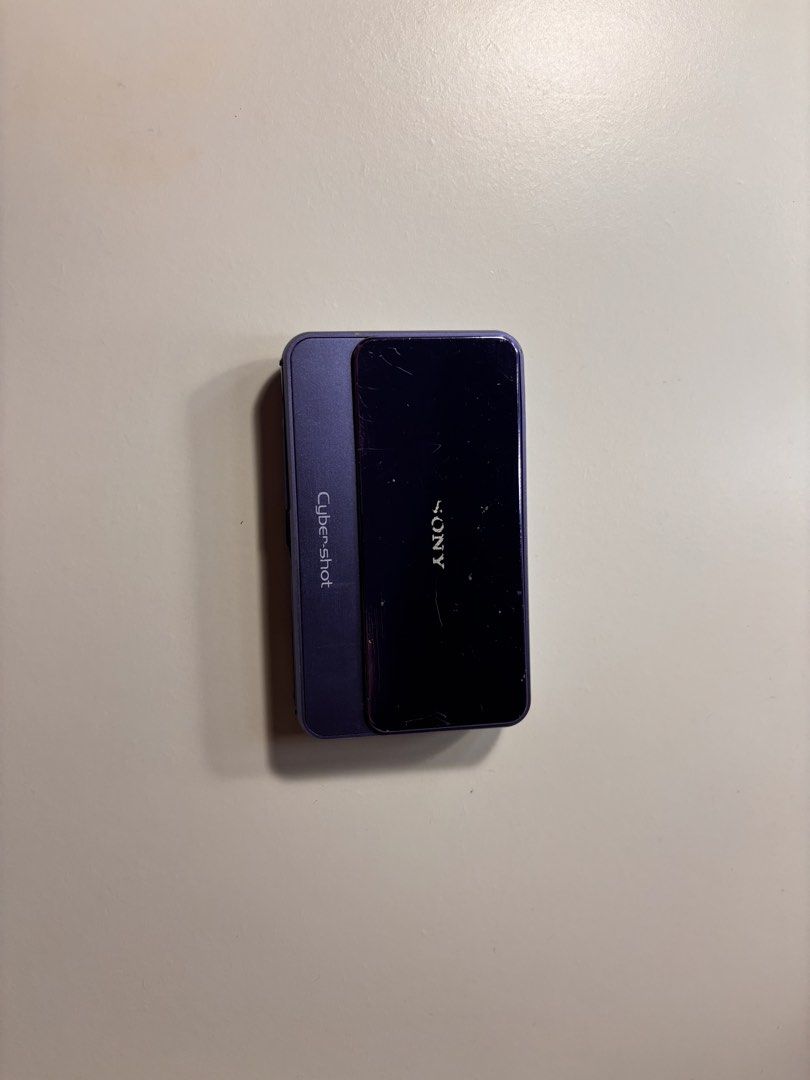 Sony Cyber-shot DSC-T110 (NEGOTIABLE) (Category: Cameras) located in Manila. Submitted by cuppyju (Listing ID 1469093621, Image 1). Description: - Model: Purple Sony Cyber-shot DSC-T110 digital camera - Resolution: 16.1 Megapixels with Carl Zeiss Vario-Tessar 4x optical lens - Display & UI: Rear touch screen interface and iconic sliding front lens cover - Condition: Excellent working condition, powers on and shoots photos, with minor scratches an