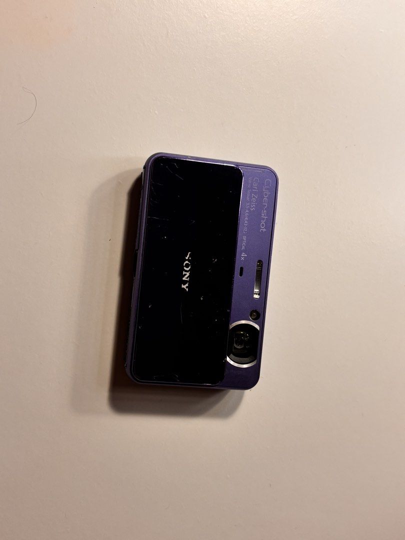 Sony Cyber-shot DSC-T110 (NEGOTIABLE) (Category: Cameras) located in Manila. Submitted by cuppyju (Listing ID 1469093621, Image 3). Description: - Model: Purple Sony Cyber-shot DSC-T110 digital camera - Resolution: 16.1 Megapixels with Carl Zeiss Vario-Tessar 4x optical lens - Display & UI: Rear touch screen interface and iconic sliding front lens cover - Condition: Excellent working condition, powers on and shoots photos, with minor scratches an