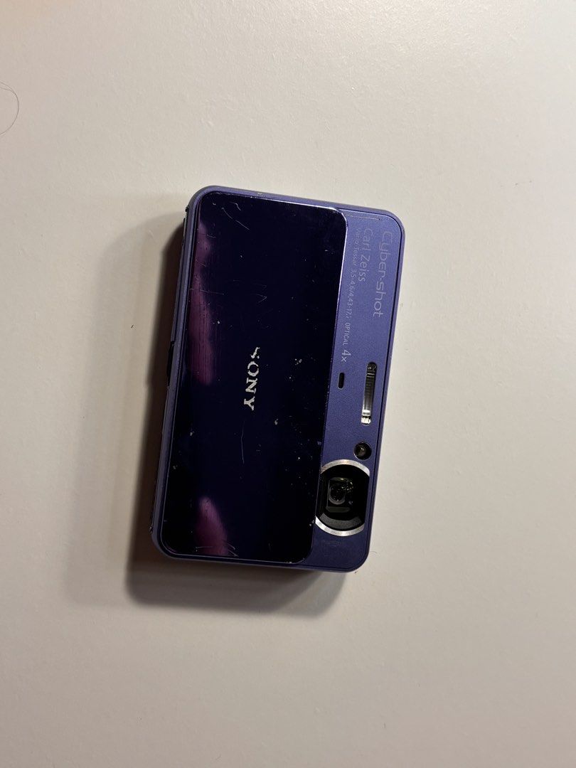 Sony Cyber-shot DSC-T110 (NEGOTIABLE) (Category: Cameras) located in Manila. Submitted by cuppyju (Listing ID 1469093621, Image 2). Description: - Model: Purple Sony Cyber-shot DSC-T110 digital camera - Resolution: 16.1 Megapixels with Carl Zeiss Vario-Tessar 4x optical lens - Display & UI: Rear touch screen interface and iconic sliding front lens cover - Condition: Excellent working condition, powers on and shoots photos, with minor scratches an