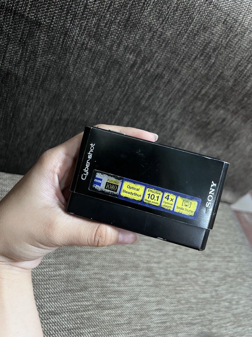 Sony Cyber-shot DSC-T77 Digital Camera (Category: Cameras) located in Manila. Submitted by macinasley96164 (Listing ID 1469056875, Image 1). Description: - Model: Sony Cyber-shot DSC-T77 (Black) - Specs: 10.1 Mega Pixels, 4x Optical Zoom, Optical SteadyShot, and touch screen interface - Features: Full HD still images and smile shutter - Condition: Powers on via top button, zoom works via side control; has scratches on the screen and body from nor