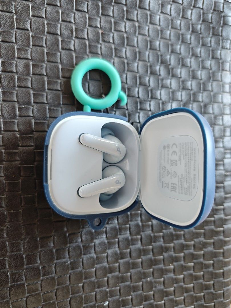 Soundcore R60i NC Wireless Earbuds (Category: Earphones) located in Quezon City. Submitted by leeisakovich (Listing ID 1468947513, Image 1). Description: - Model: Soundcore R60i NC Wireless Earbuds - Protection: Includes adorable blue Sulley (Monsters Inc.) silicone case - Accessory: Matching turquoise ring attachment included - Condition: Fully functioning charging case and earbuds, clean and ready to use.