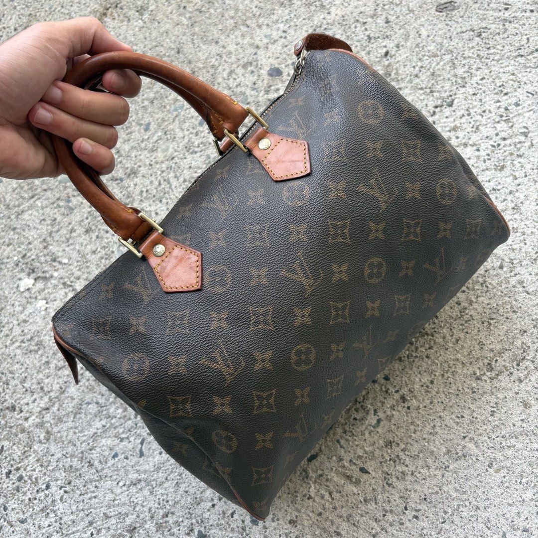 Speedy 30 (Category: Luxury Bags & Wallets) located in Angeles City. Submitted by therandomstuff011 (Listing ID 1468995896, Image 2). Description: The item in the image is a vintage Louis Vuitton Speedy handbag in the classic Monogram canvas pattern. First launched in 1930 as the "Express," the Speedy is one of the fashion house's most legendary designs. It features the signature water-resistant coated canvas body, double rolled vachetta leather 