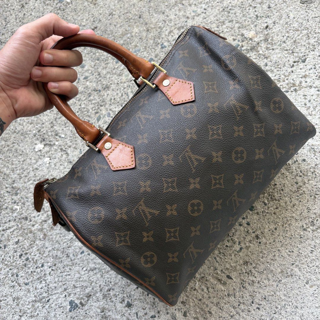 Speedy 30 (Category: Luxury Bags & Wallets) located in Angeles City. Submitted by therandomstuff011 (Listing ID 1468995896, Image 3). Description: The item in the image is a vintage Louis Vuitton Speedy handbag in the classic Monogram canvas pattern. First launched in 1930 as the "Express," the Speedy is one of the fashion house's most legendary designs. It features the signature water-resistant coated canvas body, double rolled vachetta leather 