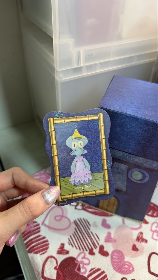 SpongeBob Squidward blindbox: Party Time (Category: Designer & Blind Box Toys) located in Pasig City. Submitted by megaraaa (Listing ID 1469081981, Image 1). Description: - Series: XII Space SpongeBob Squidward Blind Box - Character: Party Time Squidward (Pink Dress & Tiara) - Condition: Opened from the bottom to check card; inner foil bag is unopened and sealed - Inclusions: Character ID card, unopened figure, and original box - bought on Octobe