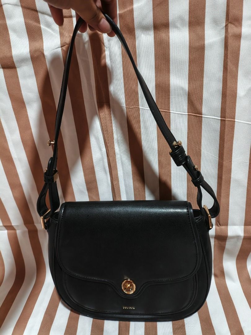 Square Black Shoulder Bag with Gold Hardware (Category: Luxury Bags & Wallets) located in Caloocan City. Submitted by silvercat.9ef446 (Listing ID 1469029107, Image 1). Description: - Brand: Square - Color: Classic Black - Style: Curved saddle shoulder bag with front flap and gold-toned turn-lock closure - Strap: Adjustable with stylish gold buckles - Interior: Clean black lining with a secure zipper pocket and Square logo patch - Condition: Exce
