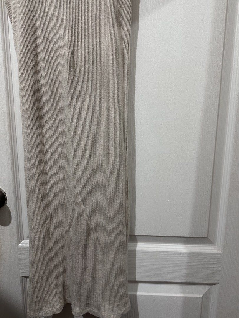 Stradivarius Ribbed Midi Skirt (Category: Skirts) located in Pasig City. Submitted by prelovedbysco (Listing ID 1469032865, Image 2). Description: - Brand: Stradivarius - Size: XS (Fits true to size) - Color: Beige - Material: Stretchy ribbed knit, super comfortable, with slit - Made in Turkey - Features: Front slit detail near the hem - Condition: Clean tag intact, excellent for daily wear Reason for selling: decluttering closet.