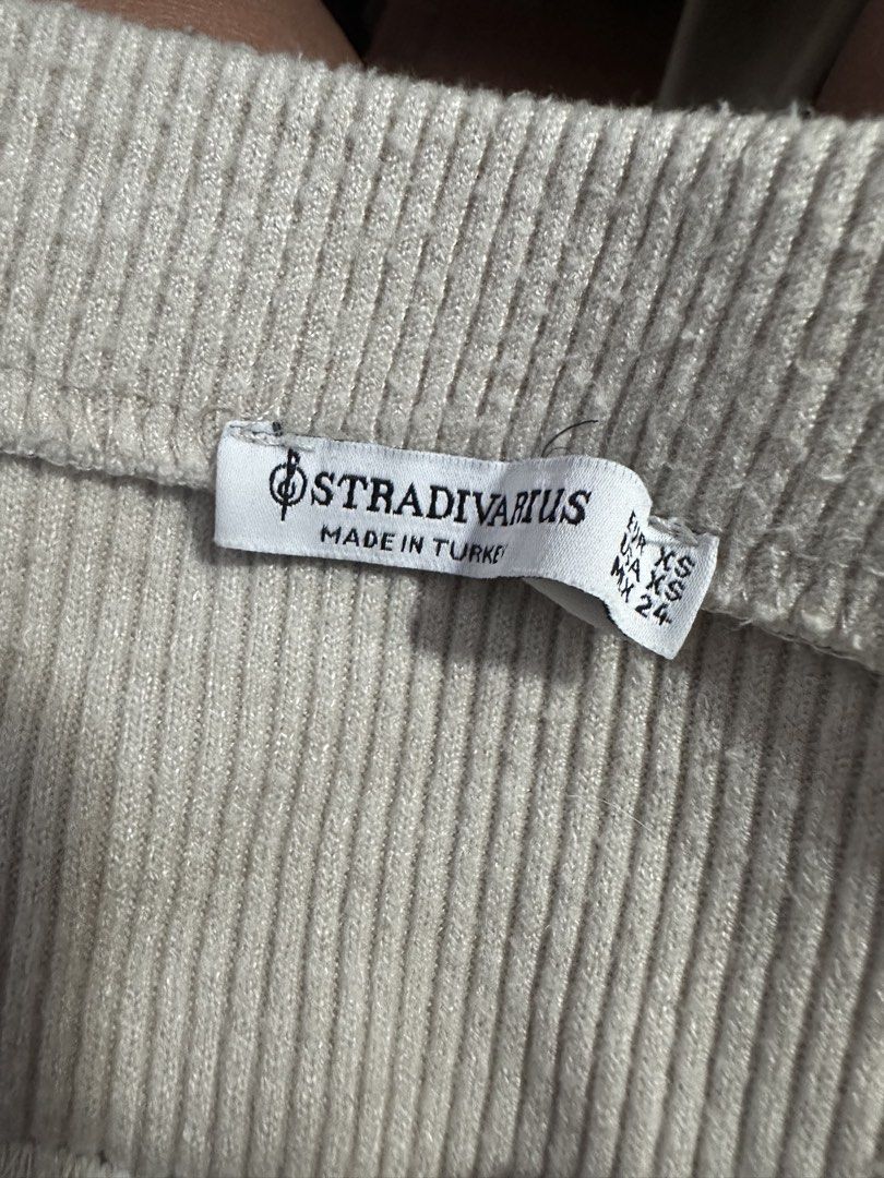 Stradivarius Ribbed Midi Skirt (Category: Skirts) located in Pasig City. Submitted by prelovedbysco (Listing ID 1469032865, Image 3). Description: - Brand: Stradivarius - Size: XS (Fits true to size) - Color: Beige - Material: Stretchy ribbed knit, super comfortable, with slit - Made in Turkey - Features: Front slit detail near the hem - Condition: Clean tag intact, excellent for daily wear Reason for selling: decluttering closet.