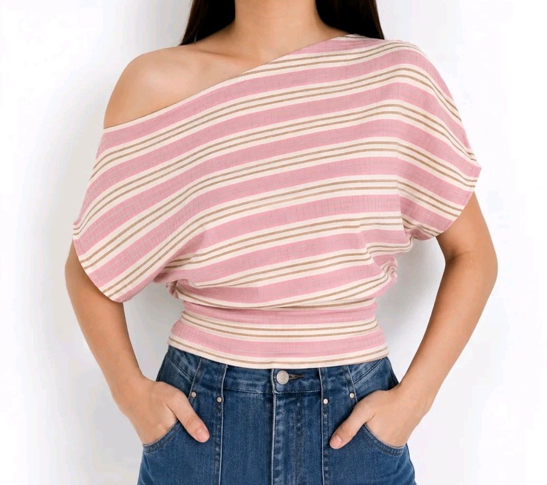 Striped Pink Off Shoulder Top (Category: Shirts) located in Makati City. Submitted by ikya_ (Listing ID 1468949474, Image 3). Description: - Color: Pink and cream stripes - Material: Super comfy ribbed textured fabric - Design: Boatneck, short sleeves, and rounded hip-length hem - Style: Casual top, perfect for daily wear - Condition: excellent / used once - Best fit: M-L, stretchable.